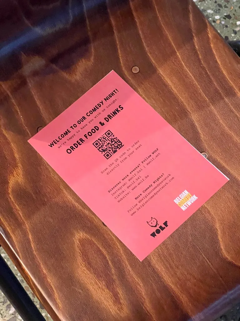 WOLF Sharing Food Market — comedy night table card with QR ordering